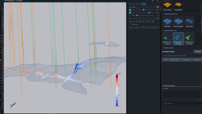 Slicing a property volume in the 3-D viewer: an i-j-k slice through the porosity grid with wells on.